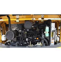 YUCHAI Yellow and black machinery engine with a black air filter.