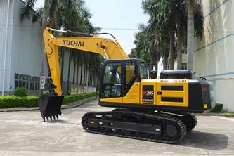 Yellow Yuchai S35 excavator on tracks, parked outdoors.