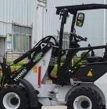 White and black YUCHAI Z25 small front-end loader vehicle with cab; parked outdoors.