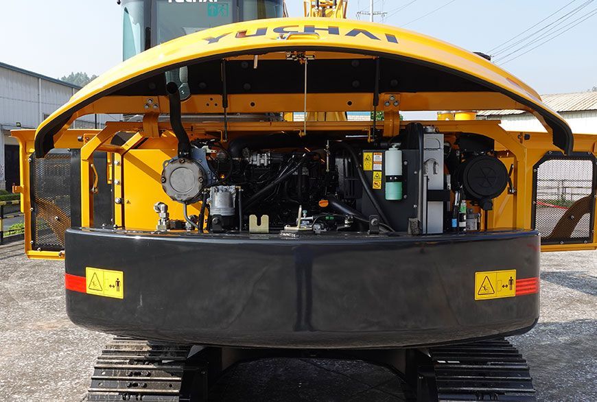 Yellow YUCHAI YC80 excavator with open engine compartment.