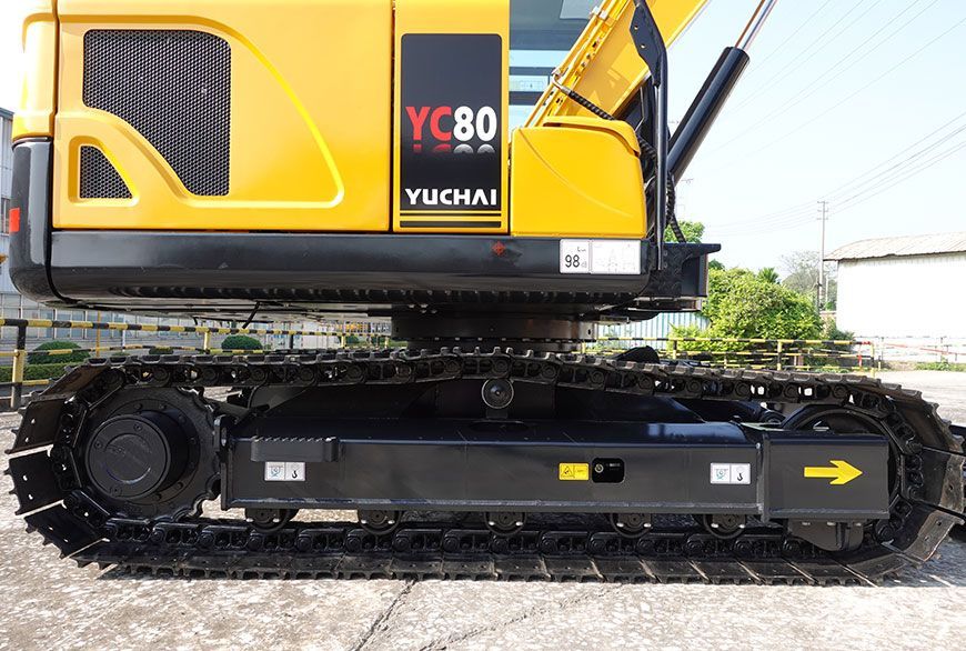 Yellow and black Yuchai YC80 excavator track.