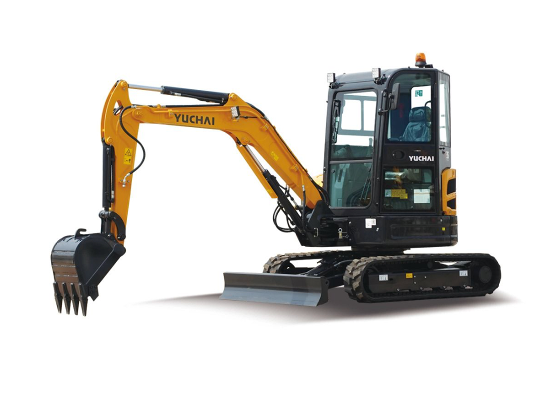 Yellow and black YUCHAI U35 mini excavator on tracks, digging, outdoors.