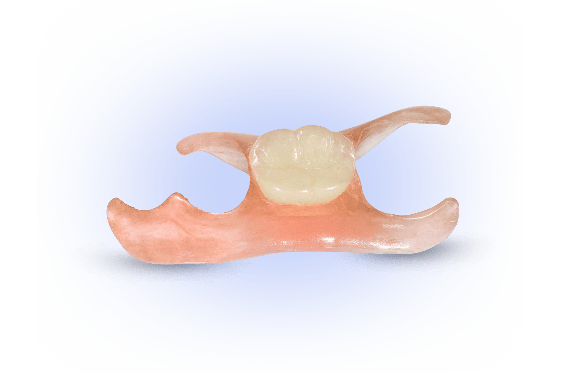 A close up of a denture with a single tooth on it