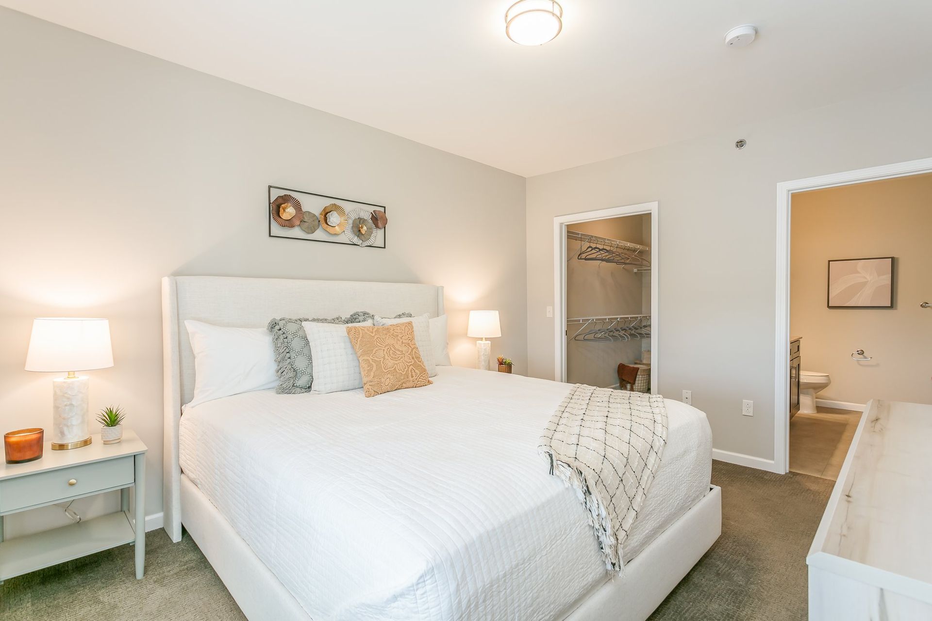 Primary bedroom with en suite bathroom and walk in closet
