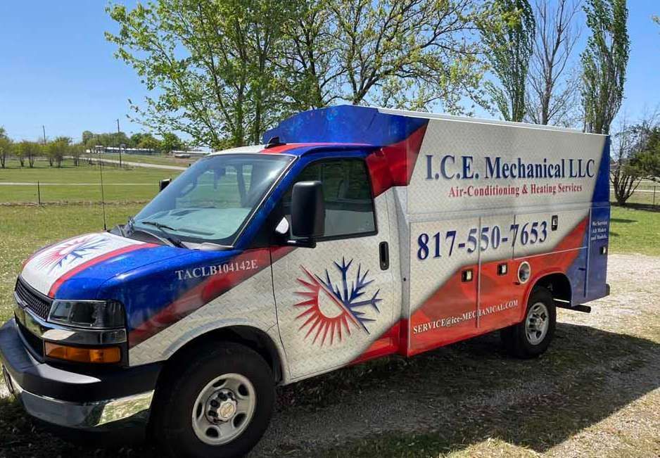 White and blue work van with logo for I.C.E. Mechanical LLC, parked outside.