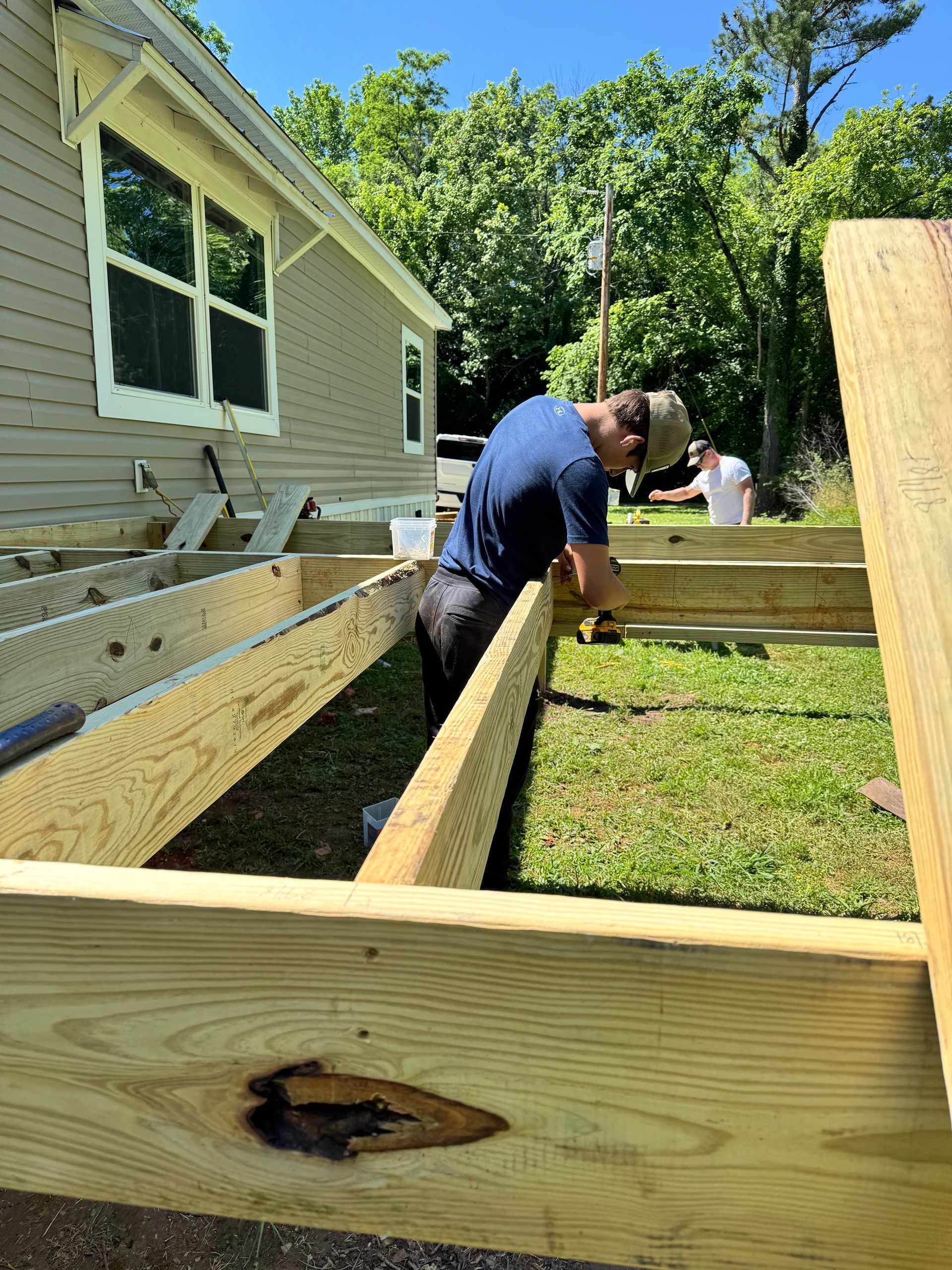 Newly built wood deck with cable railing on a brick home in Fayetteville, TN
