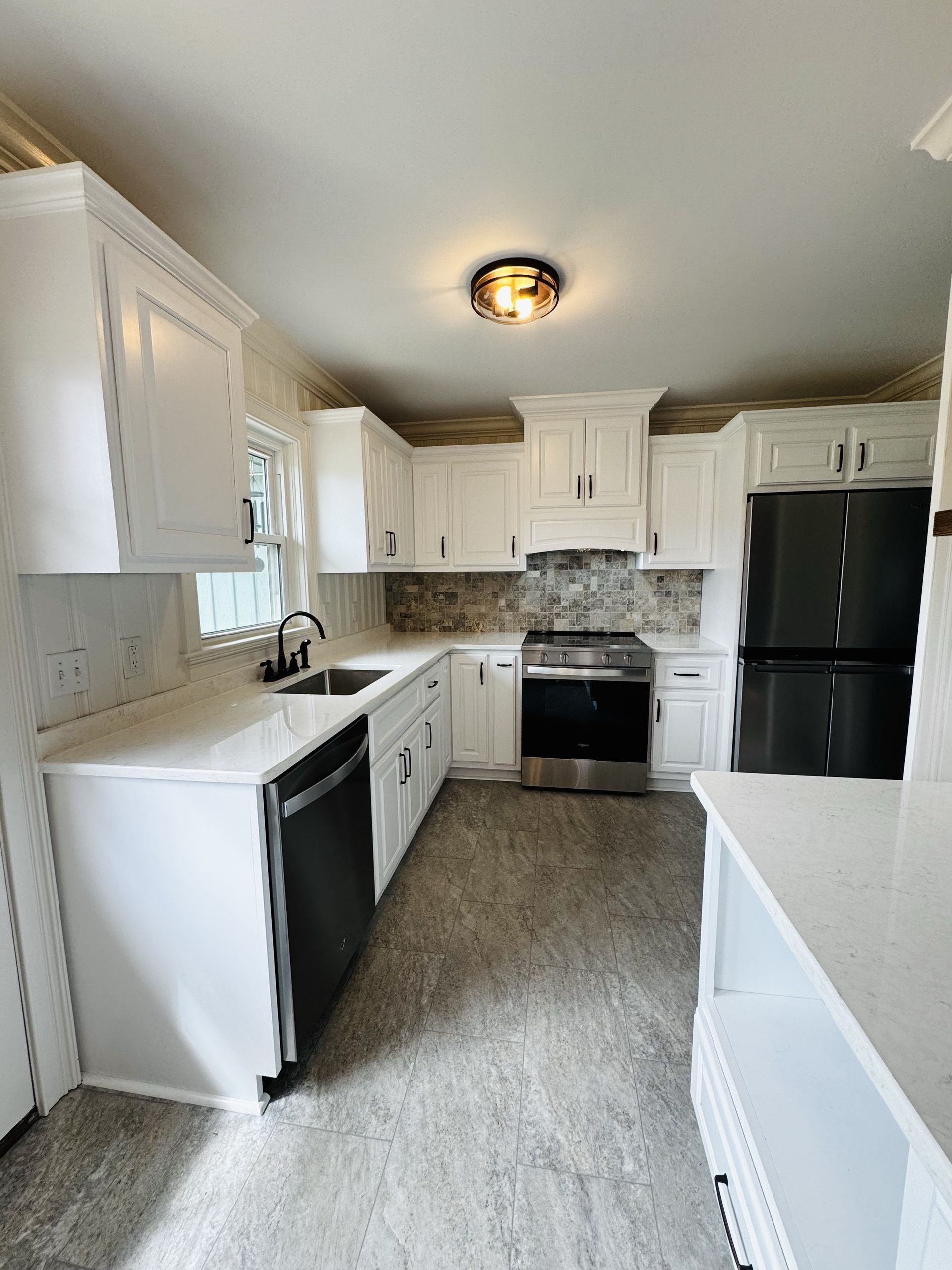 Completed kitchen remodel with new cabinetry and countertops in a Fayetteville, TN home