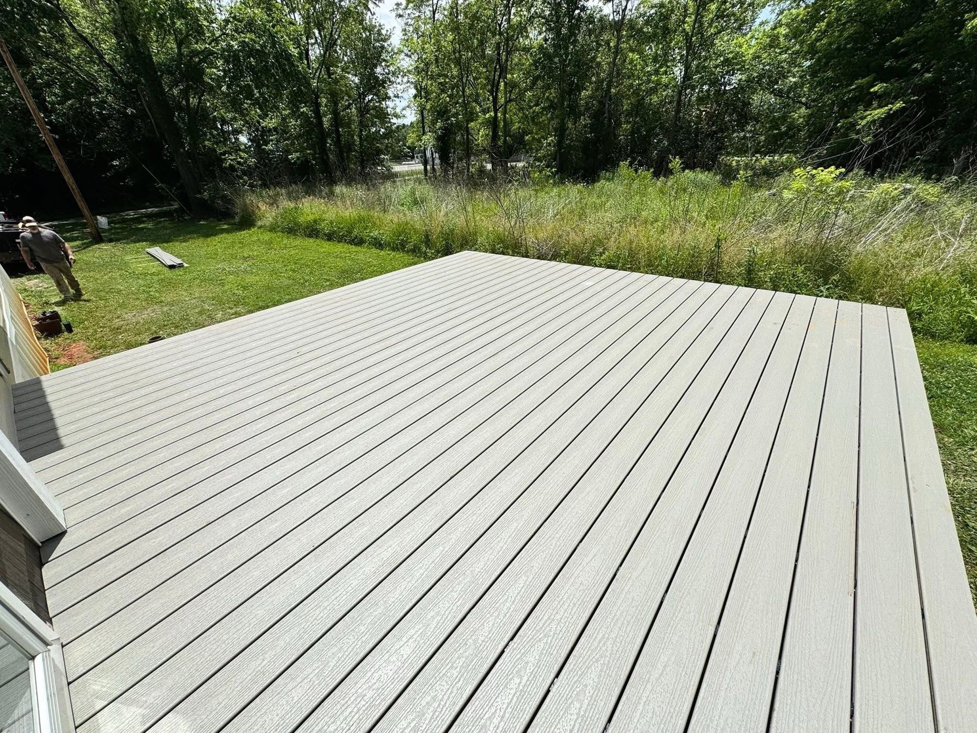 Newly built wood deck with cable railing on a brick home in Fayetteville, TN