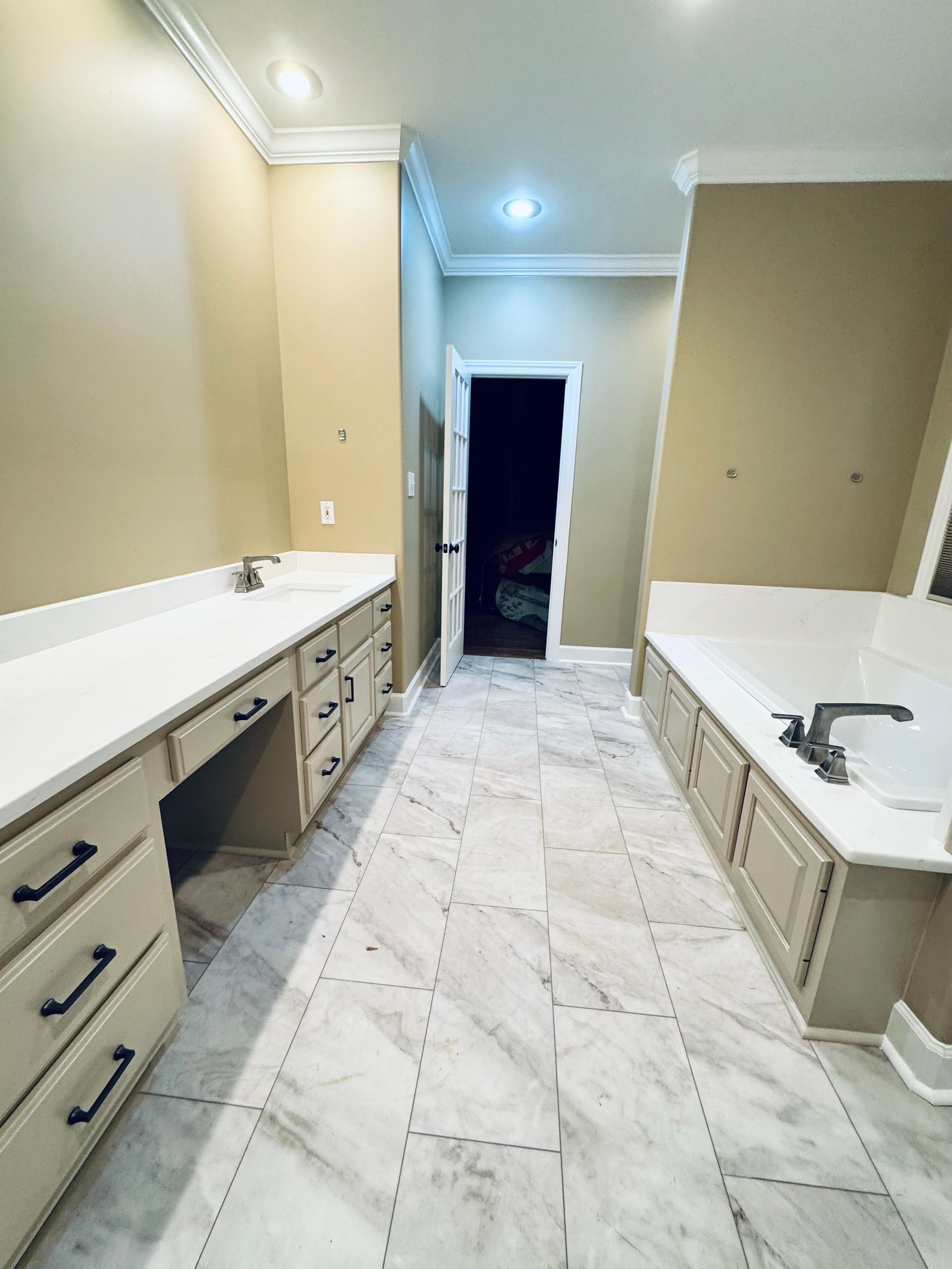 Proverbs Construction tradesperson installing bathroom tile during a Fayetteville TN bathroom remodel.