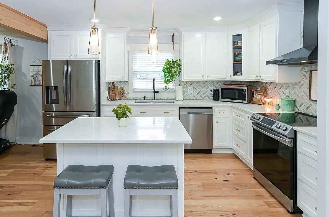 Quartz countertop and shaker cabinet hardware detail in a newly remodeled Fayetteville TN kitchen by Proverbs Construction.