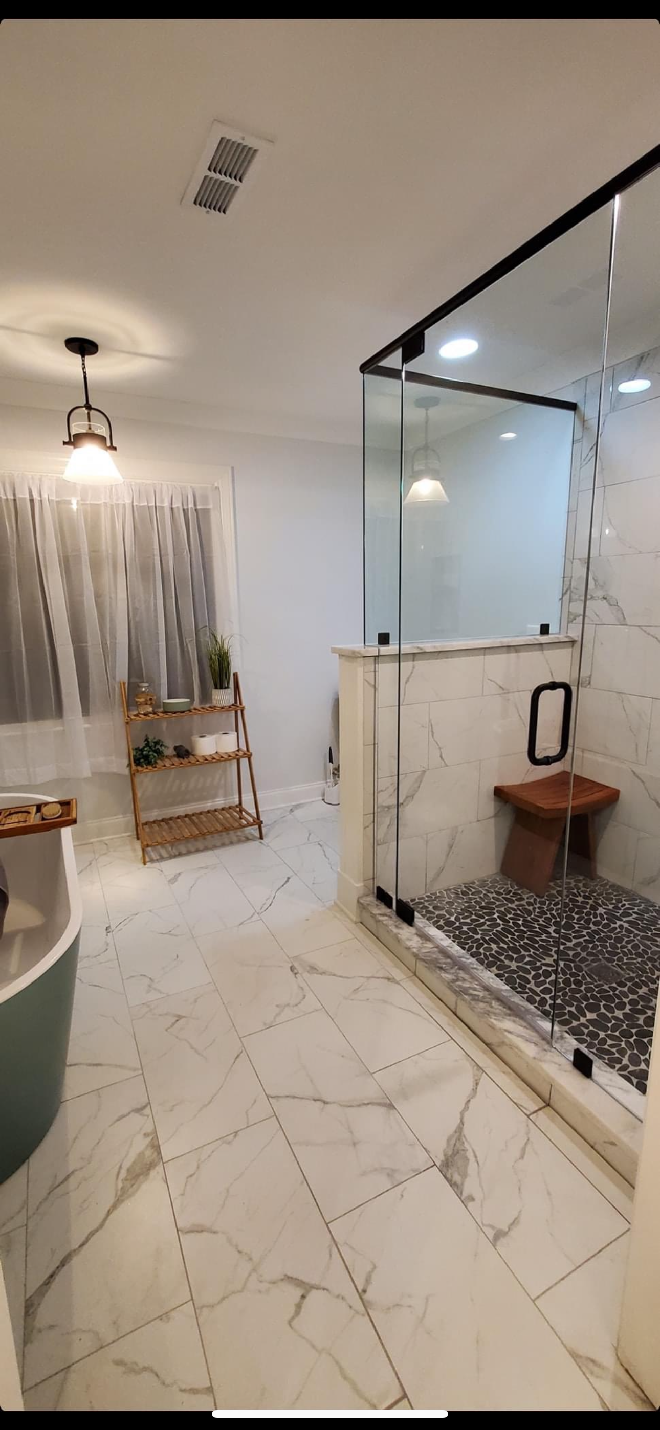 Newly tiled walk-in shower completed by Proverbs Construction during a residential bathroom renovation in Fayetteville TN.