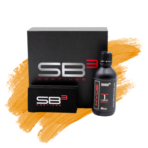 a bottle of sb3 coating sits next to a box