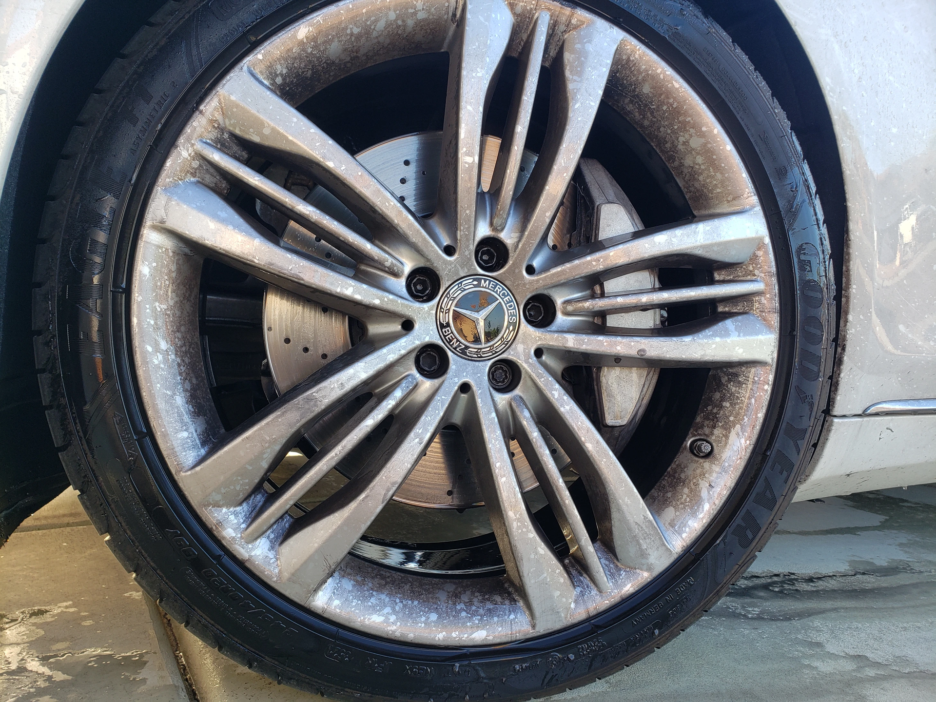 a close up of a car wheel with a tire on it .
