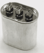Silver metal capacitor with three black terminals on top
