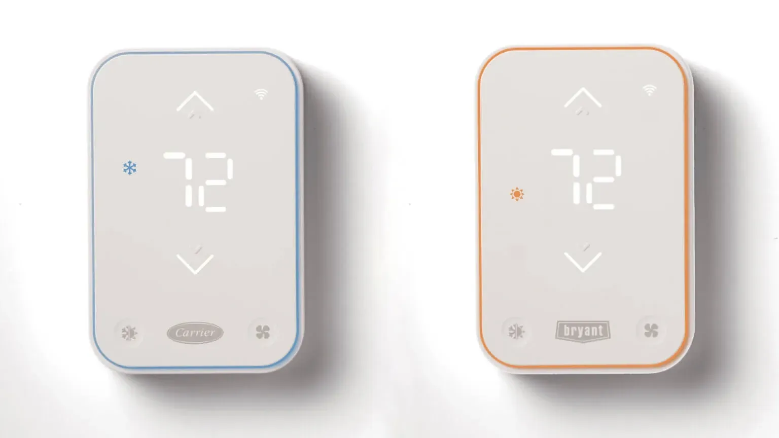 Two wall thermostats side by side, one white and one beige, both showing 72°