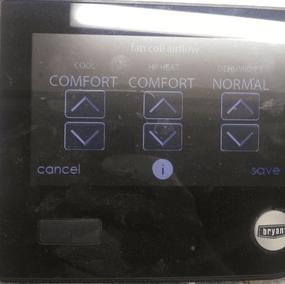 HVAC control panel with comfort/normal settings, up/down arrows, and cancel/save buttons
