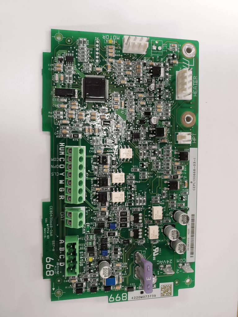 Green circuit board with chips, connectors, and mounted components on a white background