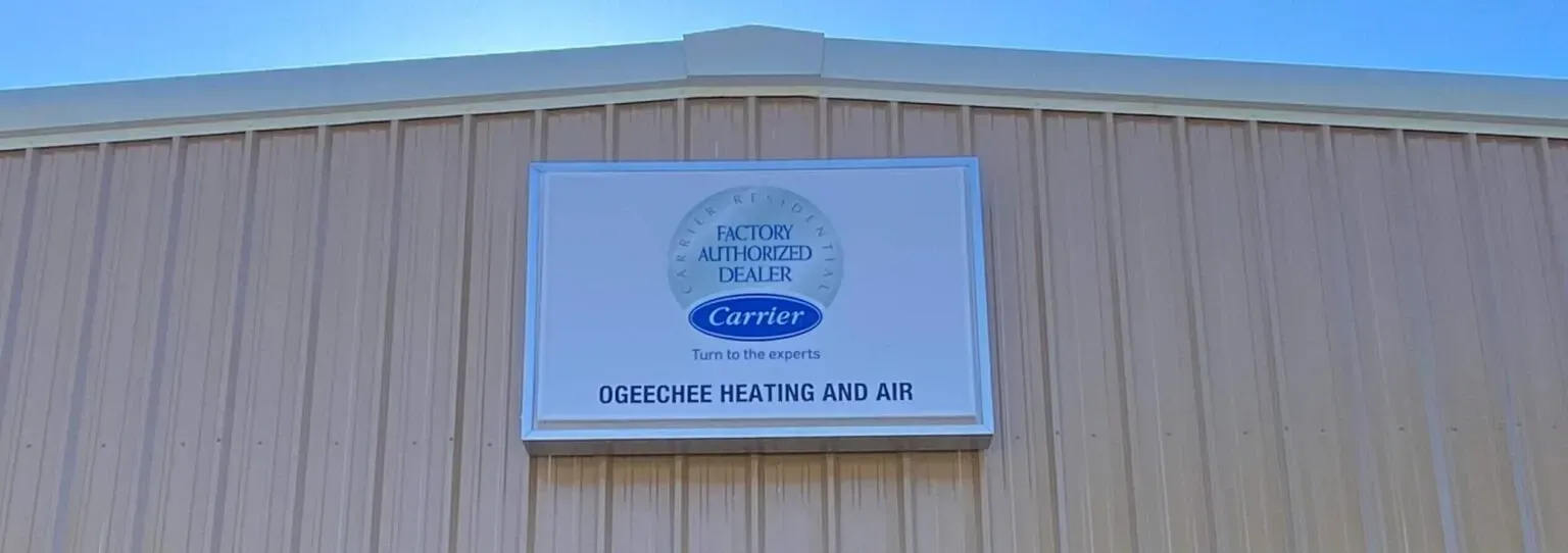 Sign on a beige building with a blue logo and text reading “Pacific Good Life”