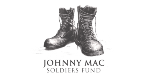 Black combat boots above the text “JOHNNY MAC SOLDIERS FUND”