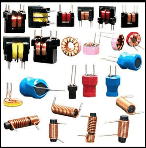 Assorted electronic inductors and coils in black, blue, red, and copper on a white background