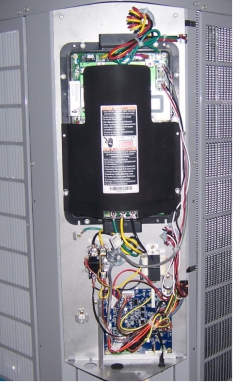 Open electrical panel with exposed wiring and components inside a metal cabinet.