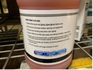 Label on a pink plastic bucket sitting on a store shelf.