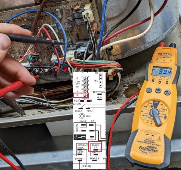 Electric panel wiring being tested with a yellow digital multimeter and a wiring diagram overlay
