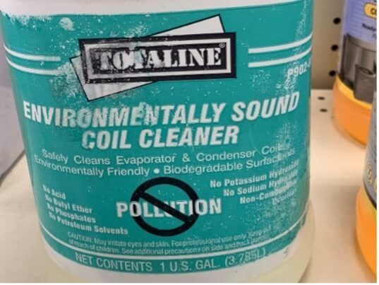 Green Totaline environmentally sound coil cleaner jug with a teal label on a store shelf