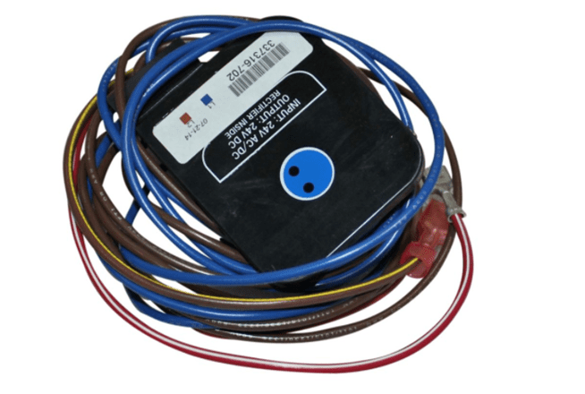 Coiled multicolored cables with a black device and blue connector port on top
