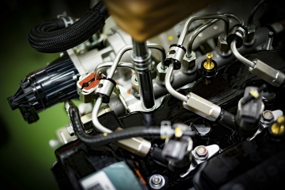 A Mechanic Uses a Tool to Tighten Metal Fuel Lines and Components — JNL Crankshaft Services in Palmerston City, NT