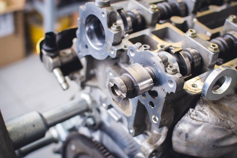 A Disassembled Car Engine Cylinder Head Showing the Exposed Camshafts — JNL Crankshaft Services in Palmerston City, NT