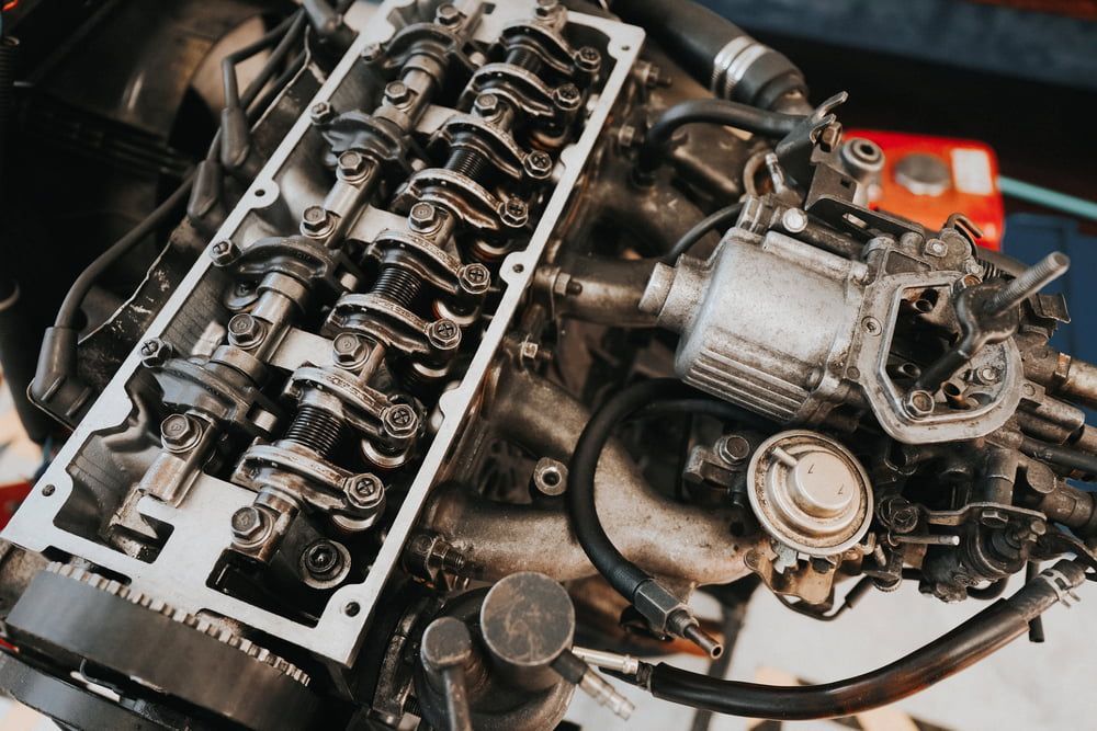 An Open, Greasy Internal Combustion Engine With a Visible Valve Train — JNL Crankshaft Services in Palmerston City, NT