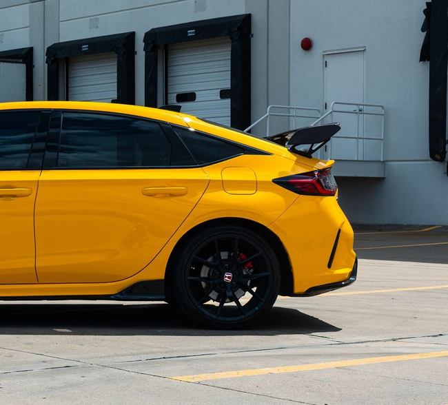 Yellow Honda Civic with tinted windows