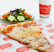 Slice of pizza, salad, and drink from Russo's New York Pizzeria on a branded paper.