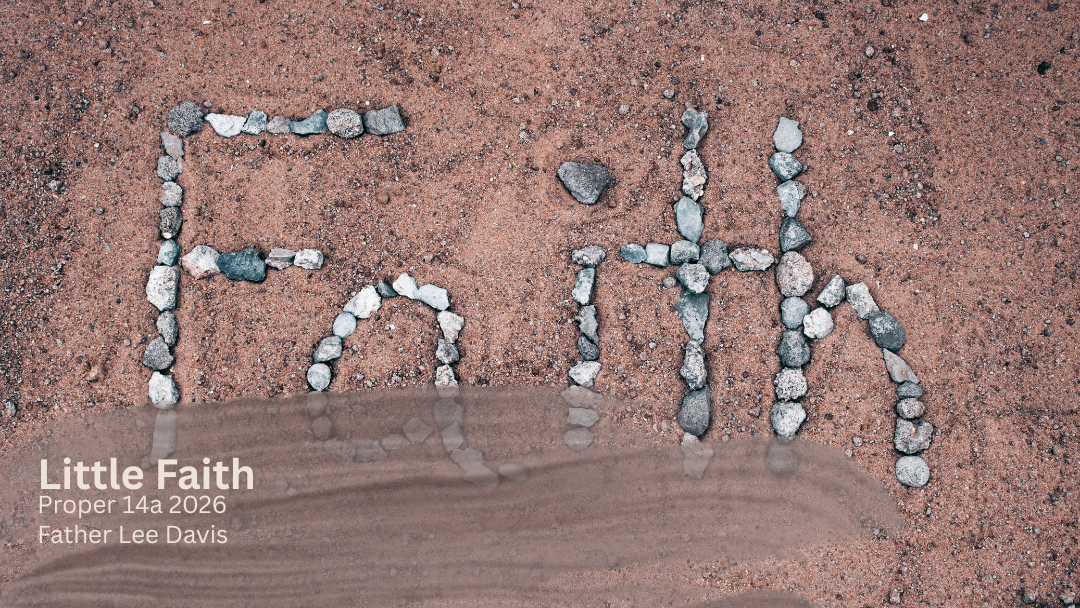 stone making the word Faith in sand