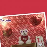 Cute teddy bear display with red heart decorations, “To cute” text, and an “L” card on a red patterned background