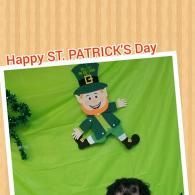 Happy St. Patrick’s Day sign with a green leprechaun decoration on a bright green background