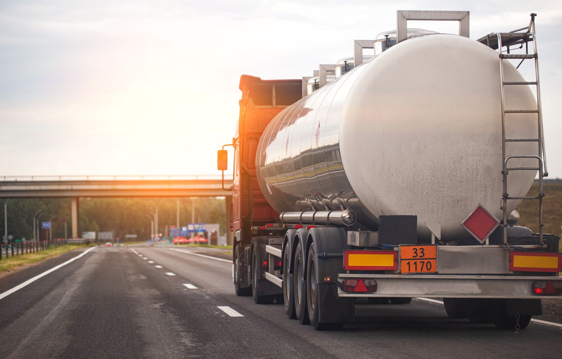 Heating oil delivery truck with tank trailer on a road