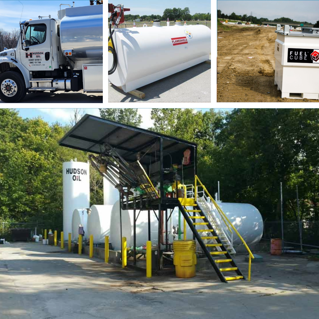 Industrial tanker truck and fuel storage tanks at a roadside fueling facility.