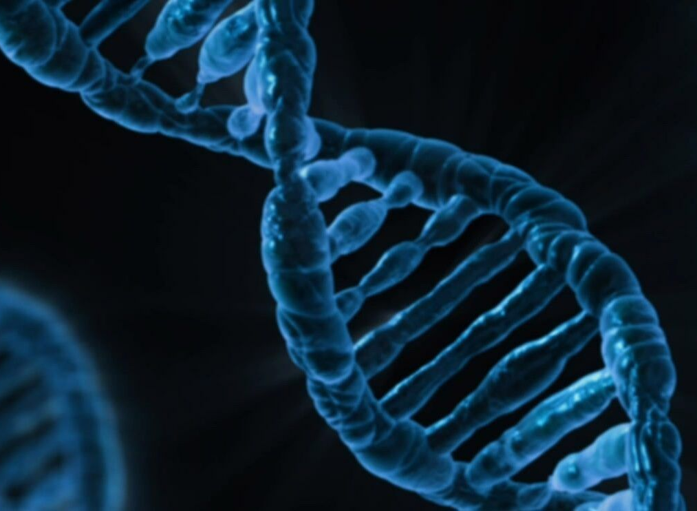 Blue DNA double helix on a dark background