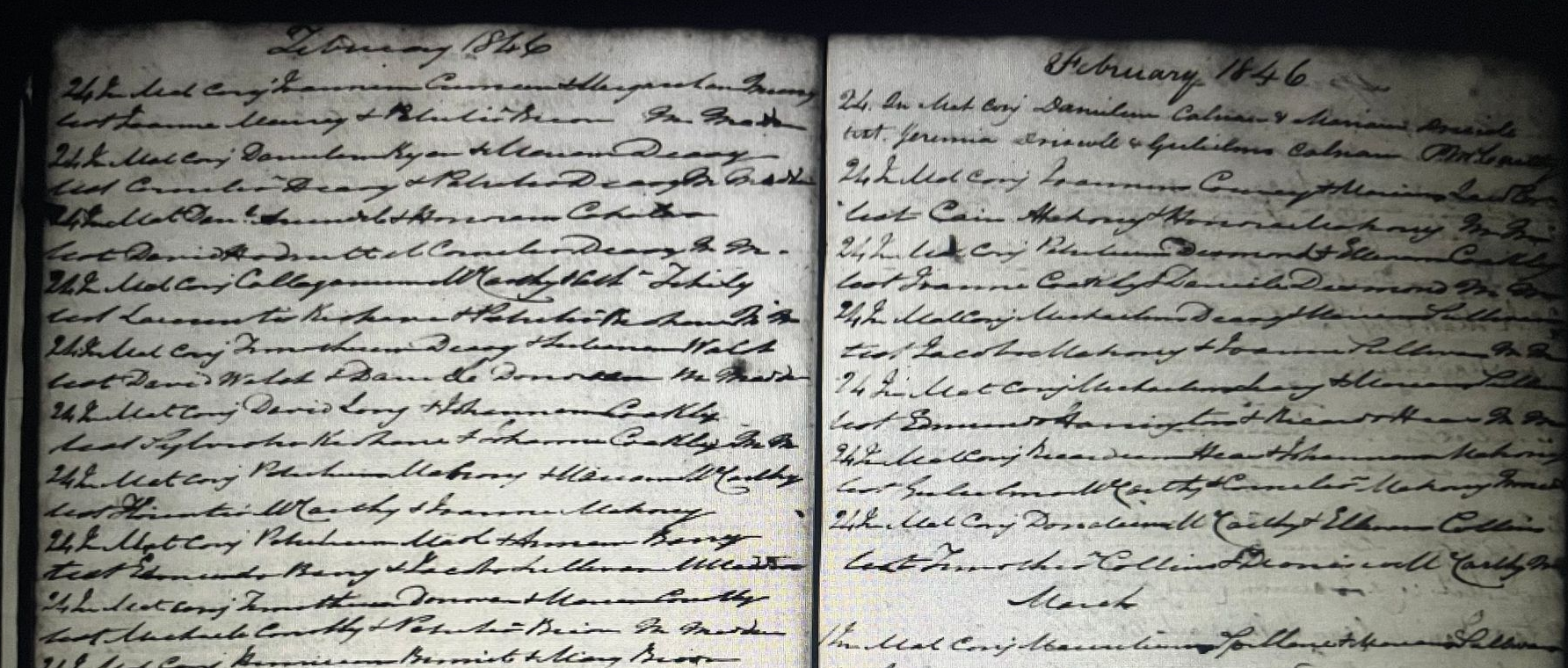 Open handwritten manuscript spread across two pages with dense black cursive text