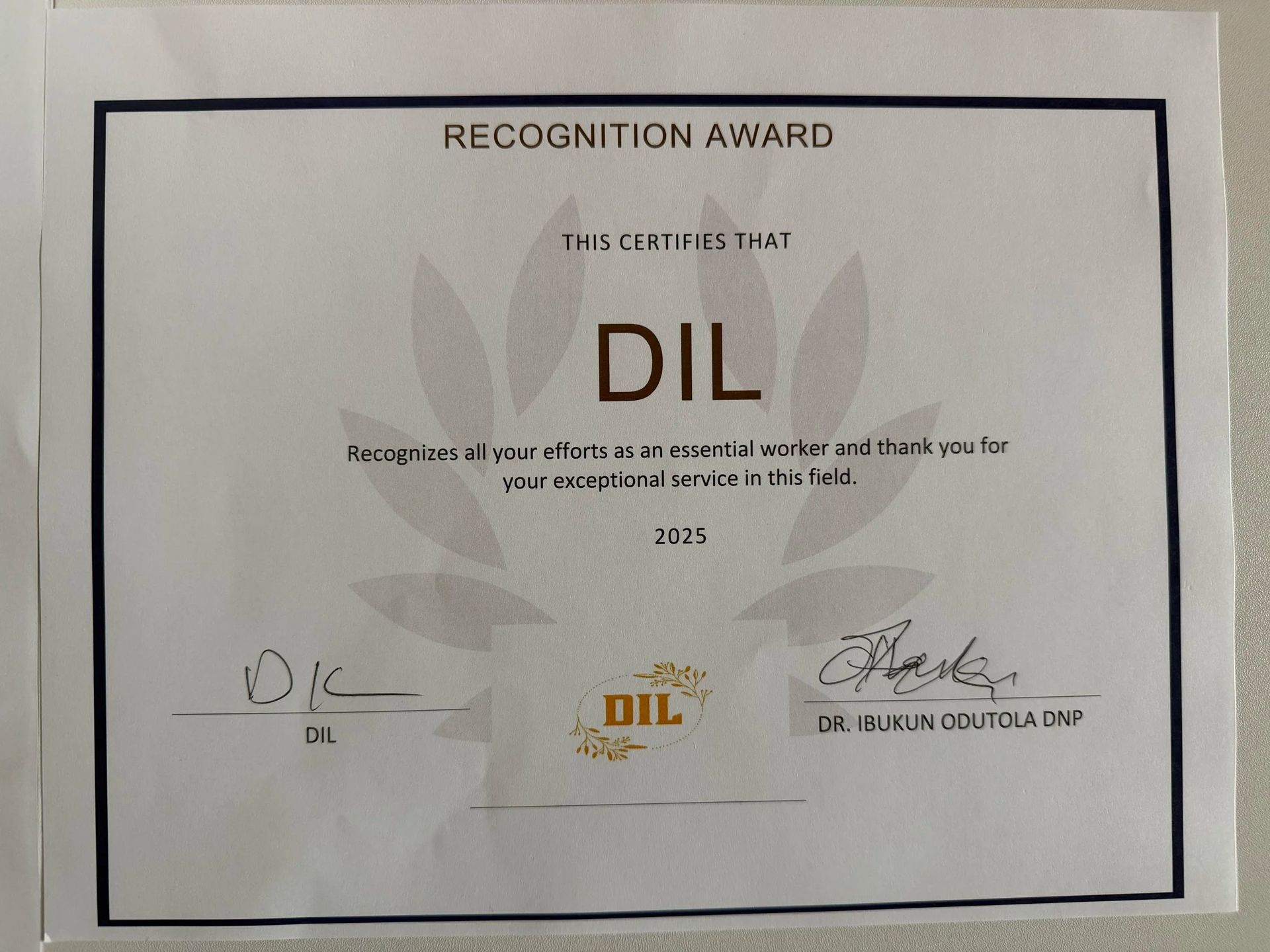 Recognition award certificate for DIL with signatures on a white background