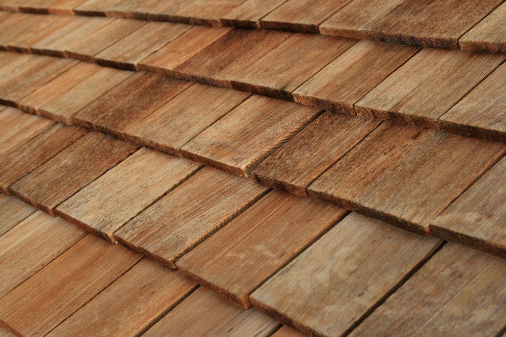 Close-up of weathered brown wooden roof shingles