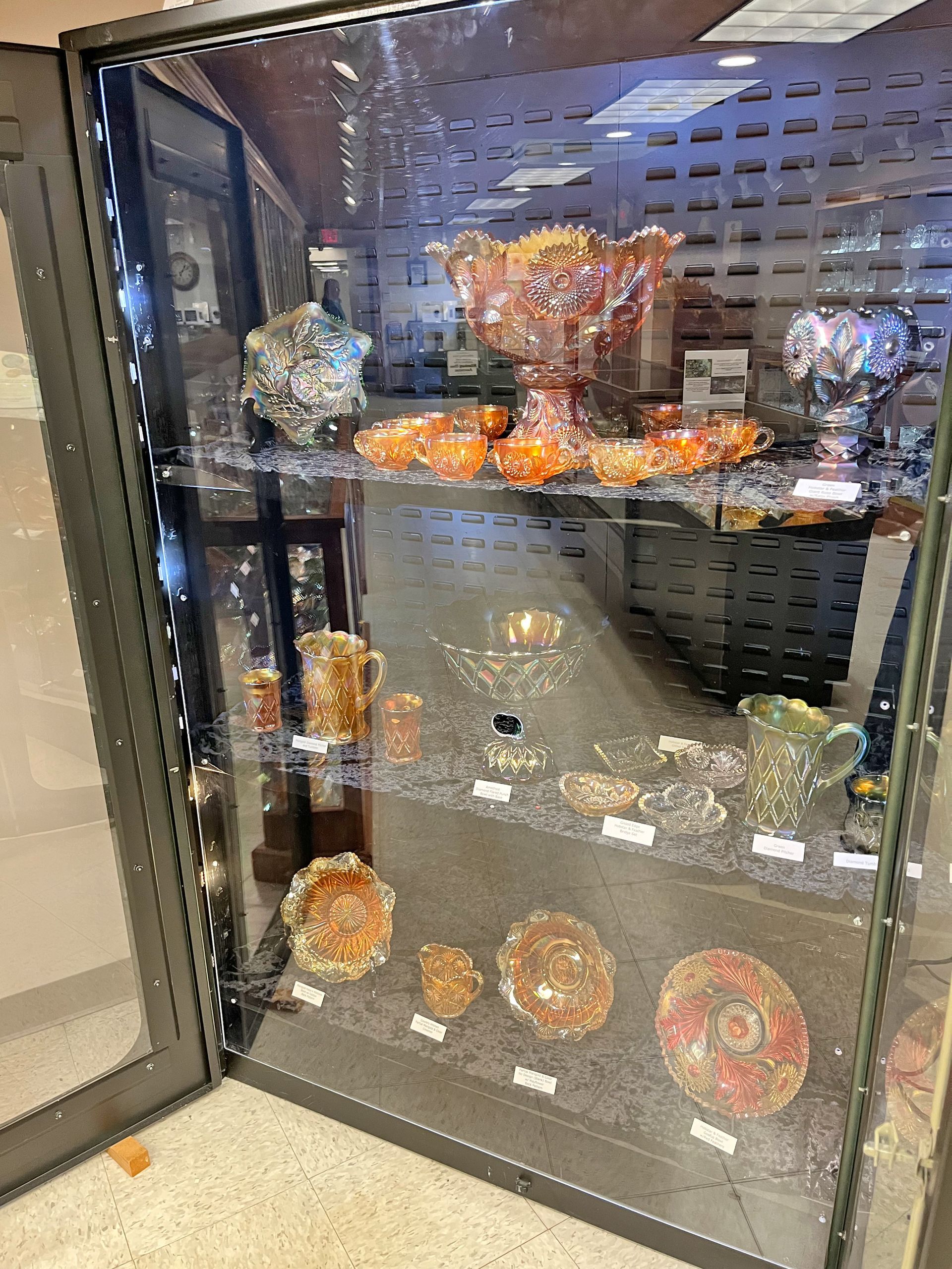 Glass display case with colorful glass art pieces.