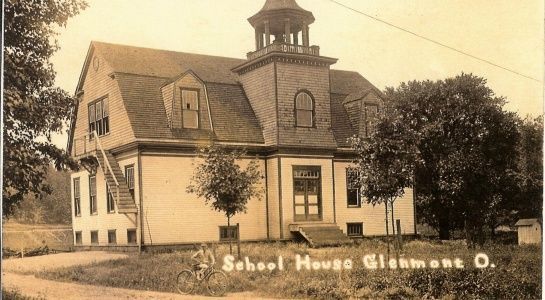 Schoolhouse, Glenmont, Ohio: Two-story building with a tower, small trees, and a grassy area.