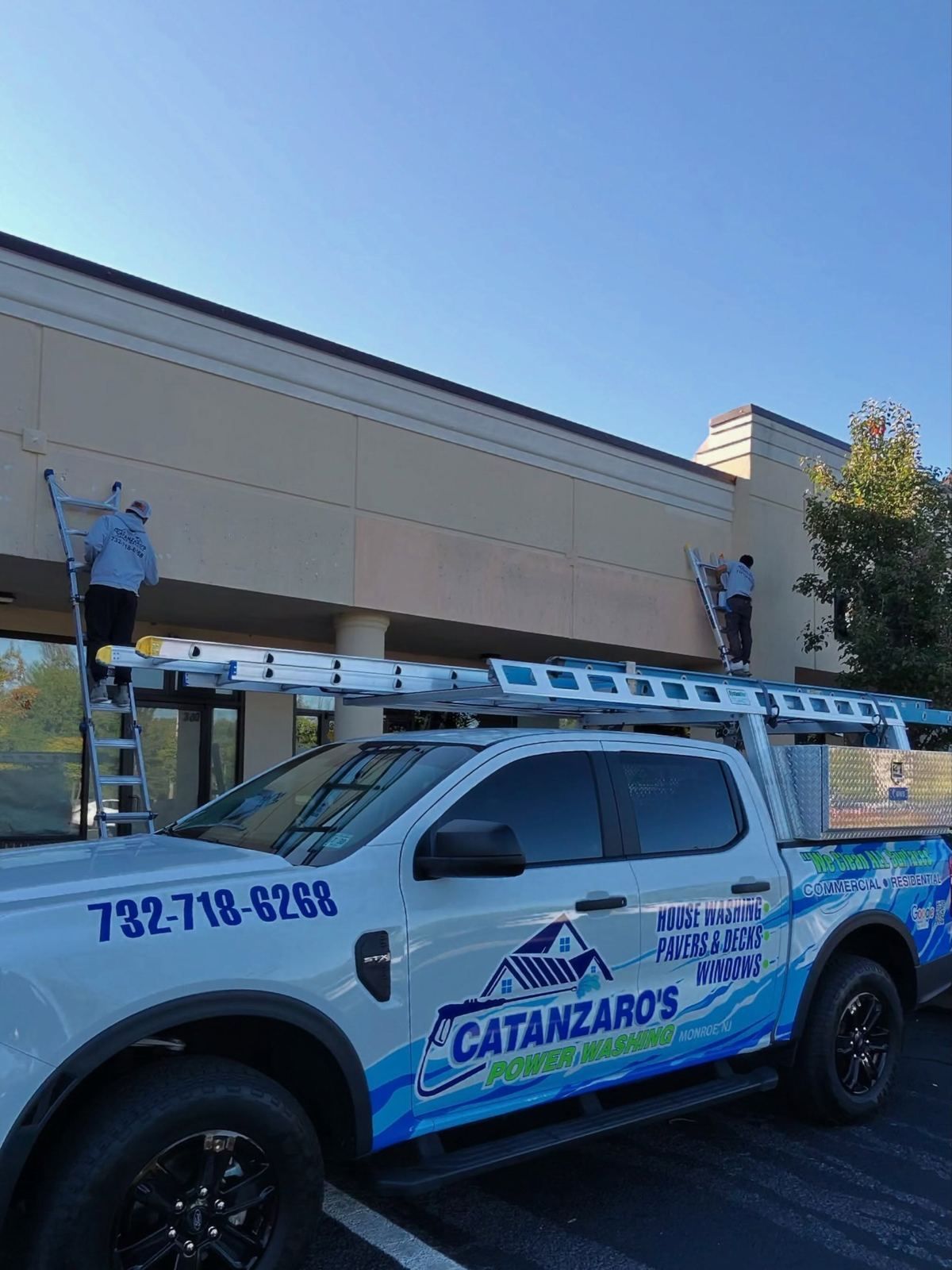 Branded truck at strip mall — Catanzaro's Power Washing