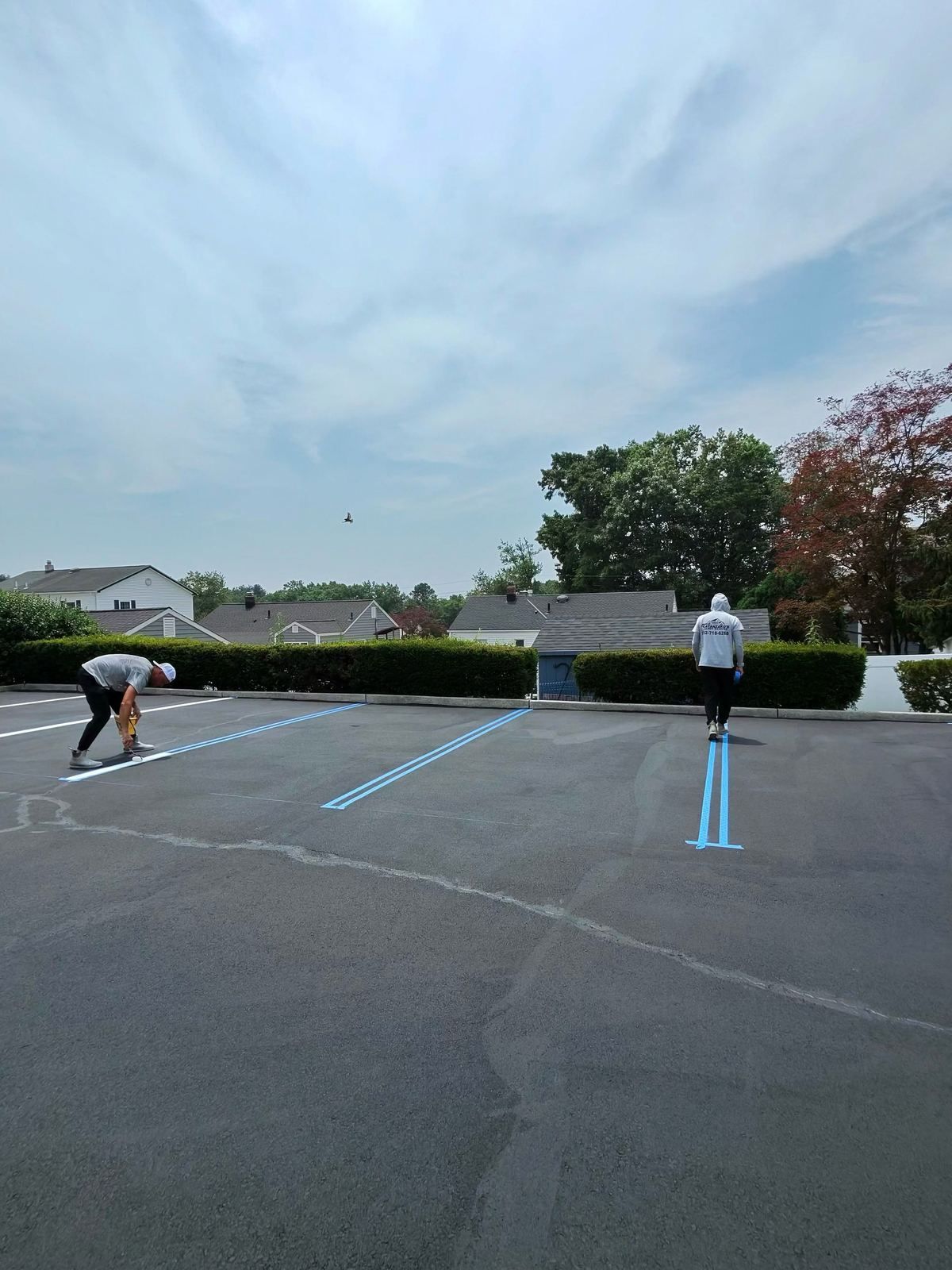Crew painting parking lot lines — Catanzaro's Power Washing