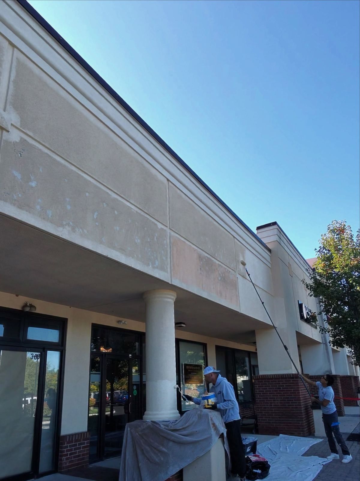 Strip mall facade, crew washing — Catanzaro's Power Washing