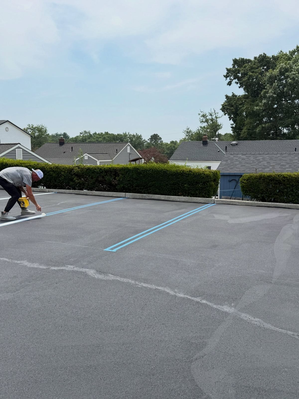 Crew striping lot — Catanzaro's Power Washing