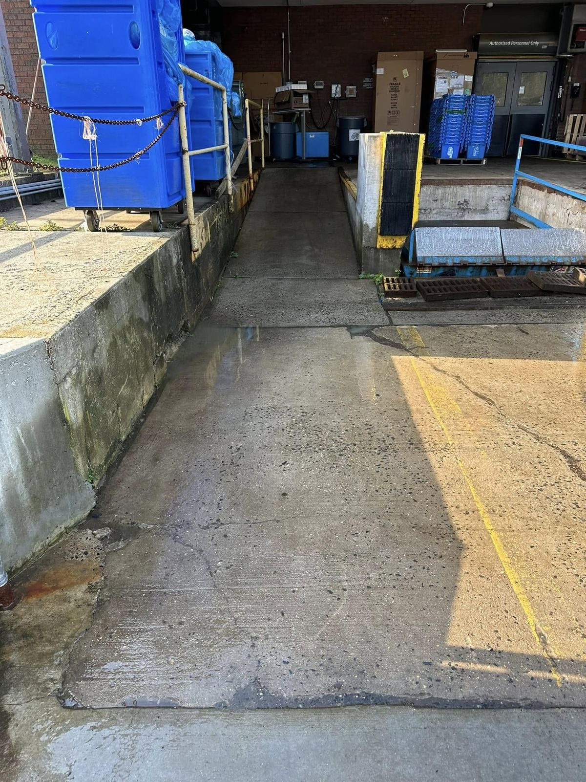 Warehouse aisle floor being washed — Catanzaro's Power Washing